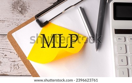 MLP word on yellow sticky with calculator, pen and clipboard