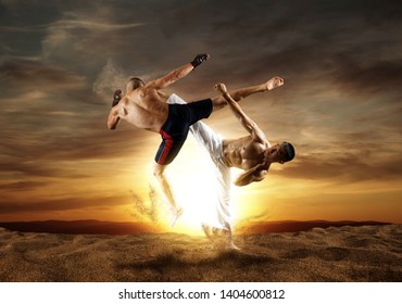MMA boxers fighters fight in fights without rules.  Sunset background  - Powered by Shutterstock