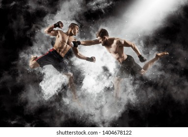 MMA boxers fighters fight in fights without rules.  Smoke background