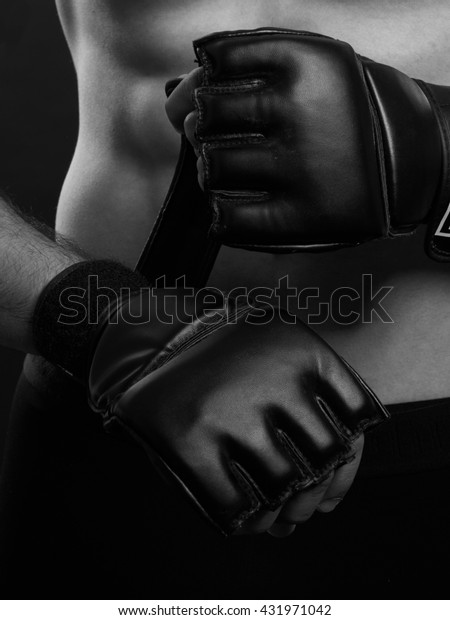 MMA Fighter putting his gloves.
