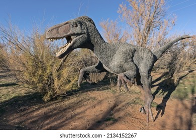 Moab, Utah, USA - November 22, 2021: Utahraptor Dinosaur Model In Natural Environment On The Moab Giants Dinosaur Trail 