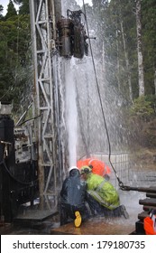 MOANA, NEW ZEALAND, MARCH 18, 2010: Drilling Crewmen Control A Small Blowout At The Mouth Of A Well For Coal Seam  Gas Near Moana, New Zealand.