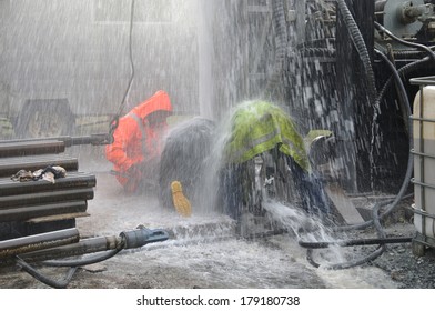 MOANA, NEW ZEALAND, MARCH 18, 2010: Drilling Crewmen Control A Small Blowout At The Mouth Of A Well For Coal Seam  Gas Near Moana, New Zealand.