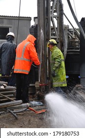 MOANA, NEW ZEALAND, MARCH 18, 2010: Drilling Crewmen Control A Small Blowout At The Mouth Of A Well For Coal Seam  Gas Near Moana, New Zealand.