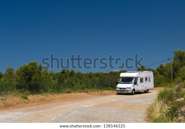 Mobil home in French\
landscape on the road