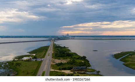 Mobile, Alabama USA 29 May 2021 The Original Oyster House And The Bluegill Restaurants On The Mobile Bay Causeway At Sunset