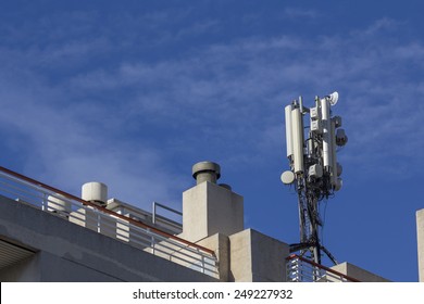 Mobile Antenna In A Building, Against Blue Sky