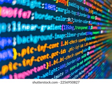 Mobile app developer. Colorful code background. Programmer workplace. Source code close-up. Vignette light and dark shadow dramatic effect. Freeware open source project. Notebook closeup photo