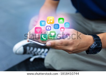 Mobile application concept.Man using touch screen smart phone