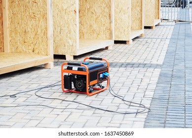 Mobile backup generator on the construction site. Standby generator - outdoor power equipment.