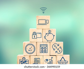 Mobile banking feature icon on wood cube pyramid with blur blur background, Digital marketing concept.