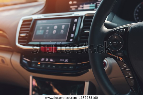 mobile call hands-free control button on steering\
wheel of modern vehicle\
car