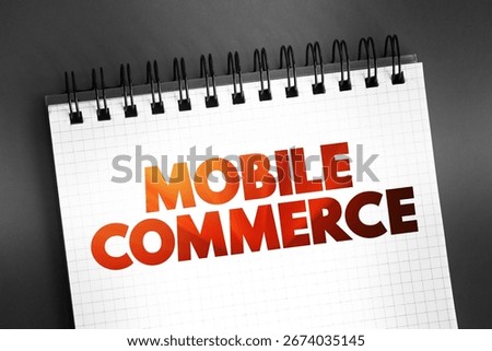 Mobile commerce - using wireless devices to conduct commercial transactions online, text concept on notepad
