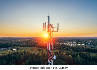 Mobile communication tower during sunset from above. (high ISO image)