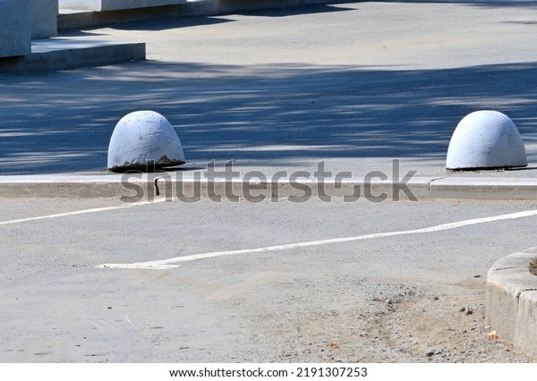 Mobile concrete\
parking fences on a summer\
day