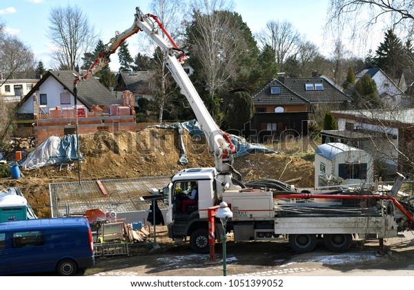 Mobile concrete pump on a\
job area at making the ground floor of a house - Berlin, Germany -\
03/21/2018