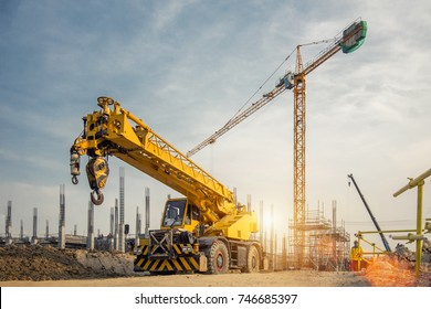 Mobile Crane on a road and tower crane in construction site