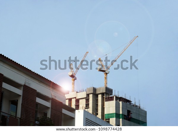  Mobile crane,hook lift crane
automobile in new building structure with blue sky             
