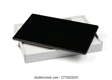 Mobile device tablet pc on special box isolated on white background. High resolution photo. Full depth of field.