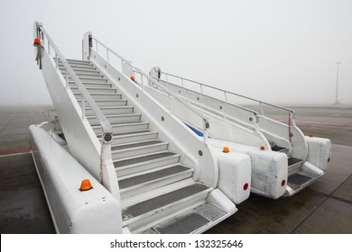 Mobile gangway for airplanes - airport in mystery fog