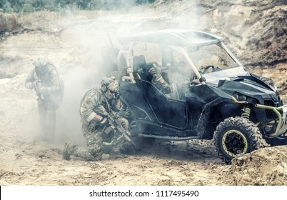 Mobile Group Of US Commandos, Special Forces Team On Desert Patrol Vehicle Fighting With Enemy, Covering Position With Smoke Screen, Calling For Reinforcements While Being Under Attack In Sandy Area