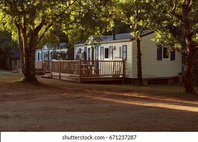 Mobile home in a French forest at Sunset