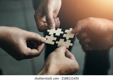 mobile jigsaw puzzle pieces business cooperation concept teamwork and cooperation Businessmen join a jigsaw team, charity, volunteerism, unity, teamwork. - Powered by Shutterstock