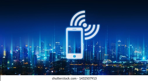 Mobile network connection technology concept, Graphic of mobile phone and wifi icon with future city background at night