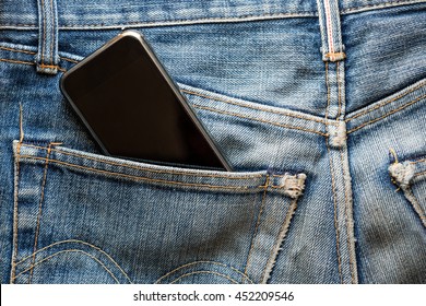 Mobile Phone In Back Pocket Faded Jeans