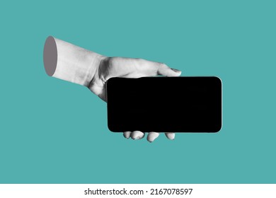 Mobile phone with black screen in female hand isolated on teal blue color background. Blank with empty copy space for the text. Trendy collage in magazine urban style. Contemporary art. Modern design