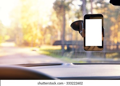 mobile phone with blank screen in car windshield holder