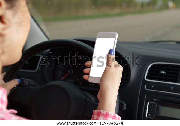 mobile\
phone with blank screen in car windshield\
holder