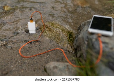 Mobile Phone Charger In The River 