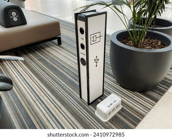Mobile phone charging point, power supply for gadgets, bollard with sockets for USB cable. High quality photo
