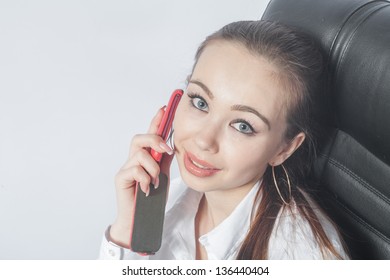 Mobile Phone Deals. Beautiful Young Woman Working In The Room Using Mobile Phone Indoors Smiling Closeup.