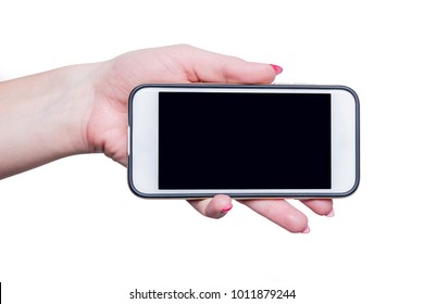 Mobile Phone In Hand. A Female Hand Is Holding A White Phone With A Blank Display Turned Sideways. Isolated White Background.