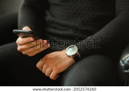 Similar – Image, Stock Photo Woman calling on phone wearing blue dress and gold wristwatch