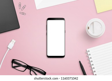 Mobile Phone With Isolated Screen On Pink, Female Desk. Phone With Rounde Edges Mockup. Flat Lay.