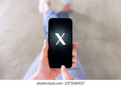 Mobile phone with a letter X on the screen