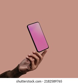 Mobile Phone Mockup Image. Screen as Empty. Hand levitating a Blank Display Smartphone. Clean and Minimal Styles - Shutterstock ID 2182589765