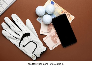 Mobile Phone, Money And Golf Glove On Color Background. Concept Of Sports Bet