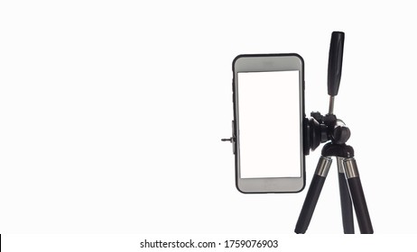 Mobile Phone Mounted On A Tripod With A White Background For Self-portraits