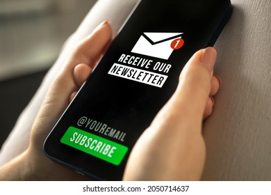 Mobile Phone With Newsletter Signup Page Closeup In Woman Hands