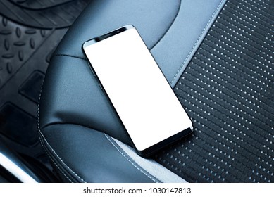 Mobile Phone On The Leather Seat Of A Car. Isolated Screen For App Or Web Site Mockup Promotion.