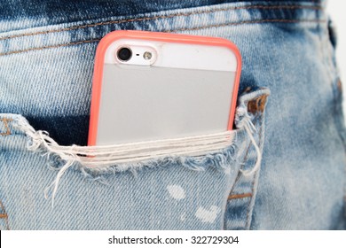 Mobile Phone In Pocket With Pink Color Case.