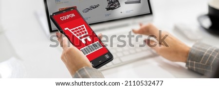 Mobile Phone With Shopping Coupon. Woman Using Online Shop