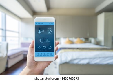 Mobile Phone With Smart Home App In Modern Living Room