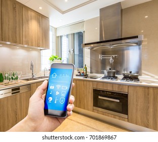 Mobile Phone With Smart Home App In Modern Kitchen