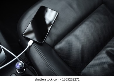 Mobile Phone, Smartphone Charge Battery, Charging In The Car Plug Close Up.