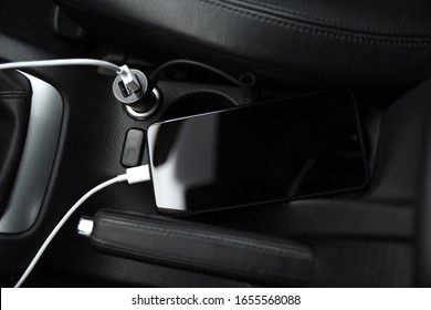 Mobile Phone, Smartphone Charge Battery, Charging In The Car Plug Close Up.